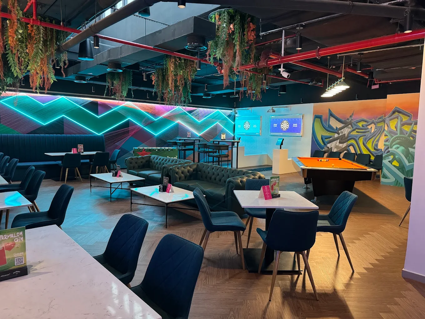 Lounge and games area at Five Iron Golf Dubai